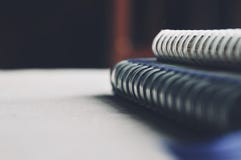 Depth Of Field Of Loop Binding Book And Pencil On The Bed With Light From The Window On The Morning Stock Photo Depth Of Field Of Loop Binding Book And Pencil On The Bed With Light From The Window On The Morning Stock Photo