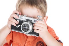 Der Junge und eine Kamera Lizenzfreie Stockfotografie Der Junge und eine Kamera Lizenzfreie Stockfotografie