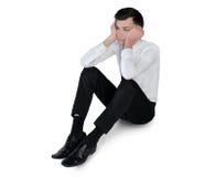 Der traurige Geschäftsmann legen nieder Lizenzfreies Stockfoto Der traurige Geschäftsmann legen nieder Lizenzfreies Stockfoto