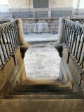Descent on ancient steps to the frozen channel royalty free stock image Descent on ancient steps to the frozen channel royalty free stock image