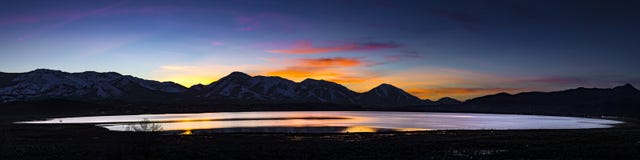 Desert lake, flooded playa at Sunset with mountain ranges and colorful clouds. Stock Photo Desert lake, flooded playa at Sunset with mountain ranges and colorful clouds. Stock Photo
