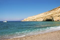 Deserted Matala beach in a sunny summer day. Crete, Greece royalty free stock photography Deserted Matala beach in a sunny summer day. Crete, Greece royalty free stock photography