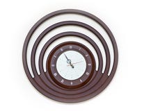 Designer Wall Clock with Round Dial on White Background royalty free stock photography Designer Wall Clock with Round Dial on White Background royalty free stock photography