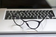 Desk with laptop, glasses and other items royalty free stock images Desk with laptop, glasses and other items royalty free stock images