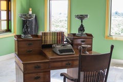 The desk in the olden days. Old typewriter And the books are in royalty free stock images The desk in the olden days. Old typewriter And the books are in royalty free stock images