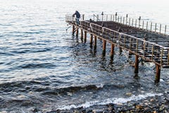 Desolated Dock On Sunset With Calm Sea Stock Photo Desolated Dock On Sunset With Calm Sea Stock Photo