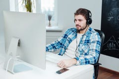 Despaired boy in front of the computer royalty free stock images Despaired boy in front of the computer royalty free stock images