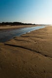Dessert like textured sand - Baltic sea gulf beach with white sand in the sunset stock images Dessert like textured sand - Baltic sea gulf beach with white sand in the sunset stock images