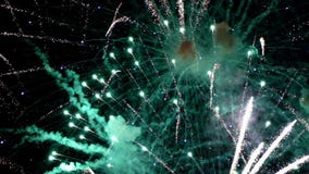 Detail of fireworks. slow motion. Detail of fireworks, Large explosions in green and blue colors. slow motion Detail of fireworks. slow motion. Detail of fireworks, Large explosions in green and blue colors. slow motion
