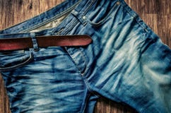 Detail Of Blue Jeans With Leather Belt In Vintage Style Stock Photography