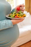 Detail Of Pregnant Woman Eating Plate Of Healthy Salad Royalty Free Stock Photo Detail Of Pregnant Woman Eating Plate Of Healthy Salad Royalty Free Stock Photo