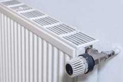 Radiator on a wall with thermostat stock photography Radiator on a wall with thermostat stock photography