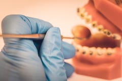 Detailed close up of dental instrument working on a denture or t stock photography Detailed close up of dental instrument working on a denture or t stock photography