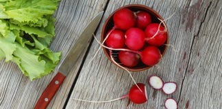 Detox Ingredients. Fresh Radishes And Lettuce Leaves Against A Wooden Background. Concept: Vegetarian Food, Healthy Food. Royalty Free Stock Photo Detox Ingredients. Fresh Radishes And Lettuce Leaves Against A Wooden Background. Concept: Vegetarian Food, Healthy Food. Royalty Free Stock Photo