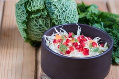 Detox red cabbage carrot pomegranate salad and cilantro dressing on white wooden background. Top view, copy space royalty free stock photography Detox red cabbage carrot pomegranate salad and cilantro dressing on white wooden background. Top view, copy space royalty free stock photography