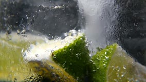 Detox or thirst concept. Healthy, dietary nutrition. Cold lemonade, lime drink. Black background. Macro close-up,refreshing soda tonic fizzy water, lime in Glass Detox or thirst concept. Healthy, dietary nutrition. Cold lemonade, lime drink. Black background. Macro close-up,refreshing soda tonic fizzy water, lime in Glass