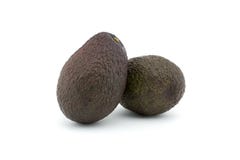 Deux avocats ou avocats sur le fond blanc L'avocat a beaucoup d'éléments nutritifs images stock Deux avocats ou avocats sur le fond blanc L'avocat a beaucoup d'éléments nutritifs images stock