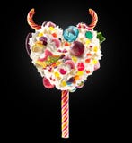 Devil Heart Milk Shake Lolipop With Sweets And Whipped Cream, Front View. Sweet Devil Lolipop Concept With Whipped Cream Royalty Free Stock Image