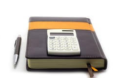 Diary with calculator and pen on white background, business manager set. royalty free stock photography Diary with calculator and pen on white background, business manager set. royalty free stock photography