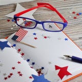 Diary with glasses open on the date of July 4, happy independence day, patriotism and memory of veterans stock photography Diary with glasses open on the date of July 4, happy independence day, patriotism and memory of veterans stock photography