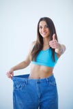 Diet. Dieting concept. Woman in Sportswear Measuring Her Waist stock images Diet. Dieting concept. Woman in Sportswear Measuring Her Waist stock images