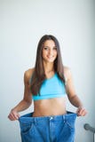 Diet. Dieting concept. Woman in Sportswear Measuring Her Waist royalty free stock photos Diet. Dieting concept. Woman in Sportswear Measuring Her Waist royalty free stock photos