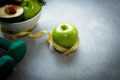Diet and Healthy life Concept. Green apple and Weight scale measure tap with fresh vegetable, royalty free stock images Diet and Healthy life Concept. Green apple and Weight scale measure tap with fresh vegetable, royalty free stock images