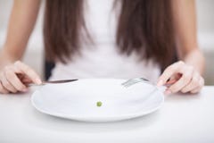 Diet. Suffering from anorexia. Cropped image of girl trying to p