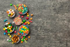Different Colored Round Candy In Bowl And Jars. Top View Of Large Variety Sweets And Candies With Copy Space Stock Photography Different Colored Round Candy In Bowl And Jars. Top View Of Large Variety Sweets And Candies With Copy Space Stock Photography