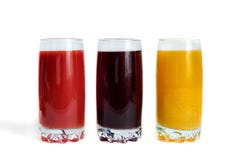 Different juices and fruits on wooden table on brown background royalty free stock photo Different juices and fruits on wooden table on brown background royalty free stock photo