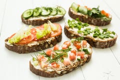 Different kinds of colorful sandwiches on white wooden background royalty free stock photos Different kinds of colorful sandwiches on white wooden background royalty free stock photos