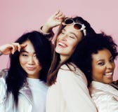 Different Nation Girls With Diversuty In Skin, Hair. Asian, Scandinavian, African American Cheerful Emotional Posing On Stock Photography