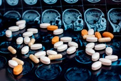 Different pharmaceutical medicine pills on magnetic brain resonance scan mri background. Pharmacy theme, health care royalty free stock photography Different pharmaceutical medicine pills on magnetic brain resonance scan mri background. Pharmacy theme, health care royalty free stock photography