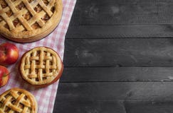 Different sizes apple pies on a rustic table. Above view with copy space stock image Different sizes apple pies on a rustic table. Above view with copy space stock image