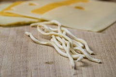 Different types of cheese on a wooden plank stock photography Different types of cheese on a wooden plank stock photography