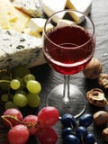 Different Types Of Cheeses With Wine Glass And Fruits. Stock Image Different Types Of Cheeses With Wine Glass And Fruits. Stock Image