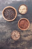 Different types of rice in small bowls stock image Different types of rice in small bowls stock image