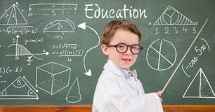 Boy teacher explaining diagrams on blackboard royalty free stock photo Boy teacher explaining diagrams on blackboard royalty free stock photo