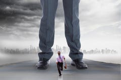 Small business man running from a big business man royalty free stock photos Small business man running from a big business man royalty free stock photos