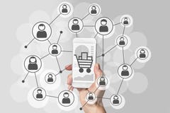 Digital marketing and mobile sales concept with hand holding modern smart phone and social network of consumers stock illustration Digital marketing and mobile sales concept with hand holding modern smart phone and social network of consumers stock illustration