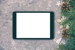 Digital minnestavlaåtlöje upp med för cementbakgrund för lantlig jul gråa garneringar för apppresentationstappning som tonas Bäst arkivfoto Digital minnestavlaåtlöje upp med för cementbakgrund för lantlig jul gråa garneringar för apppresentationstappning som tonas Bäst arkivfoto