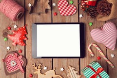 Digital tablet mock up with rustic Christmas decorations for app presentation stock photography Digital tablet mock up with rustic Christmas decorations for app presentation stock photography