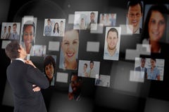 Digitally generated image of confused businessman looking at human resourcing Royalty Free Stock Image Digitally generated image of confused businessman looking at human resourcing Royalty Free Stock Image