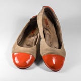 Dirty female shoes with orange socks glossy. stock images Dirty female shoes with orange socks glossy. stock images