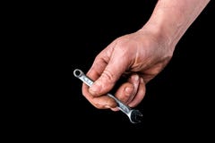 Dirty hand with wrench on black background. royalty free stock image Dirty hand with wrench on black background. royalty free stock image
