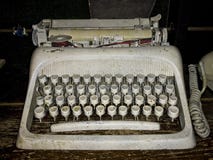 Dirty old typewriter on wooden shelf. royalty free stock images Dirty old typewriter on wooden shelf. royalty free stock images
