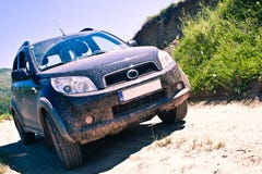 Dirty SUV On A Mountain Road Royalty Free Stock Photo Dirty SUV On A Mountain Road Royalty Free Stock Photo
