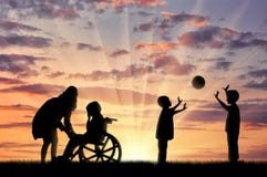 Disabled child in wheelchair crying and his mother near children play with ball Stock Images Disabled child in wheelchair crying and his mother near children play with ball Stock Images