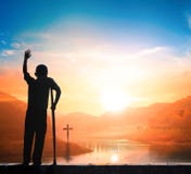 Disabled people victory concept: a disabled person in front of the cross stock images Disabled people victory concept: a disabled person in front of the cross stock images
