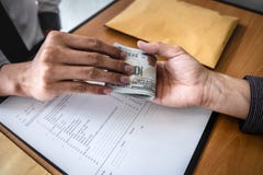 Dishonest cheating in business illegal money, Businessman receive bribe money to business people to give success the deal contract stock photography Dishonest cheating in business illegal money, Businessman receive bribe money to business people to give success the deal contract stock photography